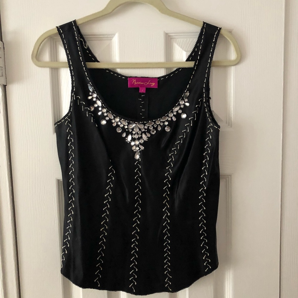 Shine in this great sparkly black top!